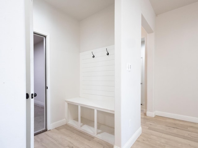 mudroom with light hardwood / wood-style floors