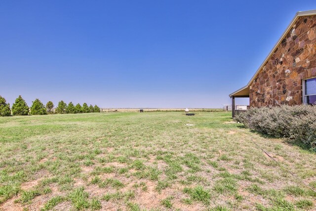 view of yard with a rural view