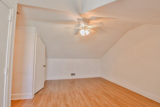 additional living space with ceiling fan, lofted ceiling, and light hardwood / wood-style floors