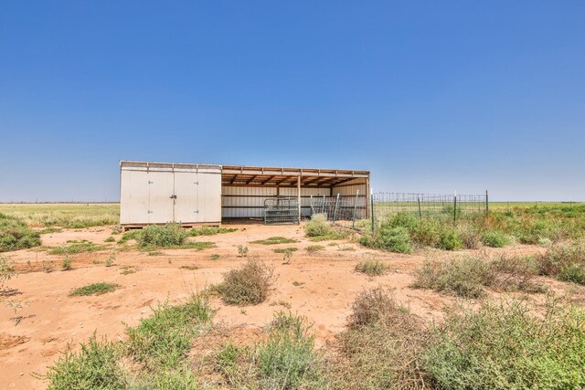 view of outbuilding featuring a rural view