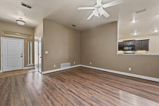 entryway featuring dark wood-type flooring and ceiling fan