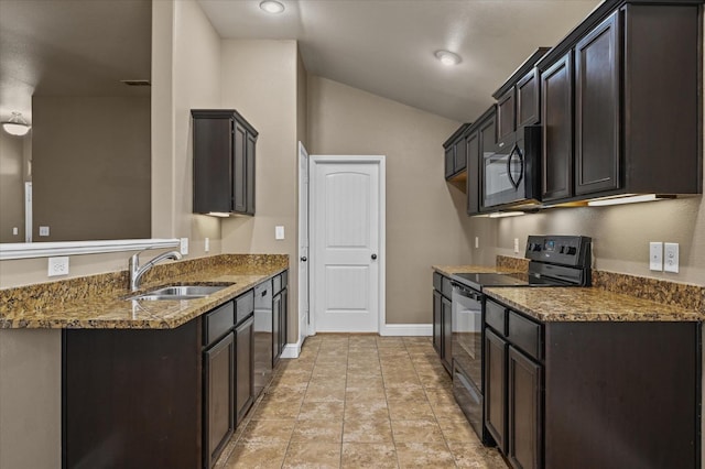 kitchen featuring vaulted ceiling, sink, dark stone countertops, black appliances, and dark brown cabinets