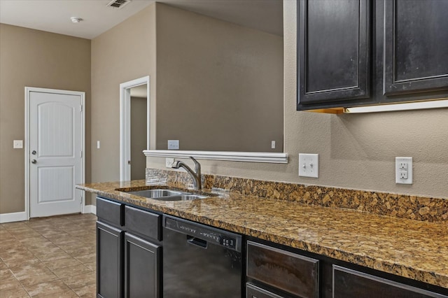 kitchen featuring black dishwasher, sink, light tile patterned floors, and dark stone counters