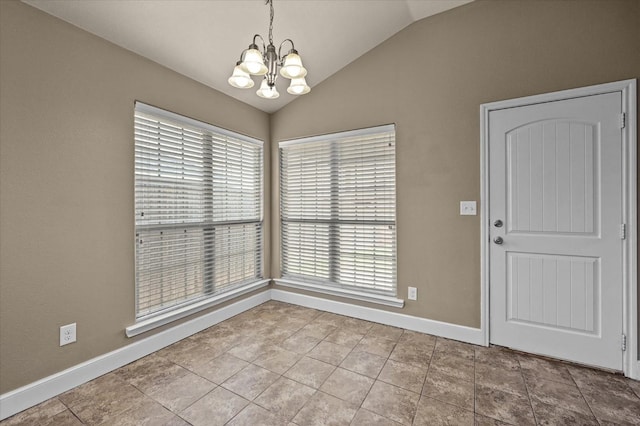 unfurnished dining area featuring tile patterned flooring, a notable chandelier, and vaulted ceiling