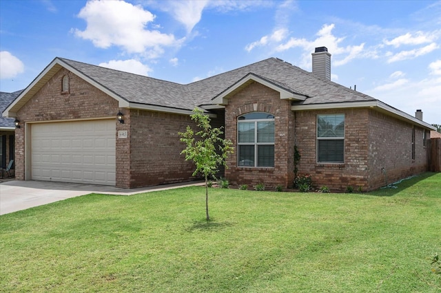 view of front of house with a garage and a front yard