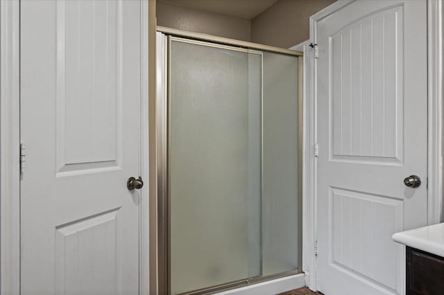 bathroom featuring vanity and walk in shower