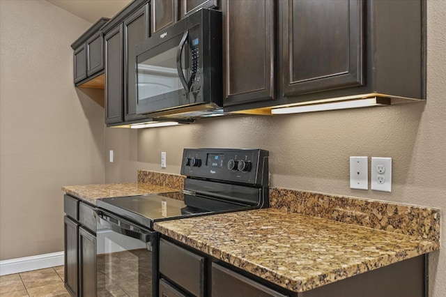 kitchen with light tile patterned flooring, light stone countertops, dark brown cabinets, and black appliances