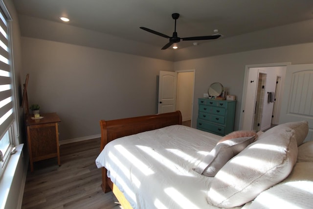 bedroom featuring recessed lighting, baseboards, and wood finished floors