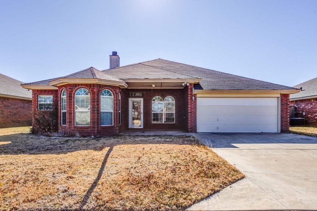 ranch-style home featuring a garage