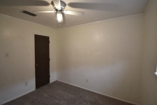 carpeted spare room with crown molding, ceiling fan, and a textured ceiling