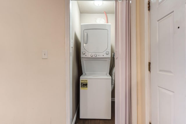 clothes washing area with stacked washer / drying machine