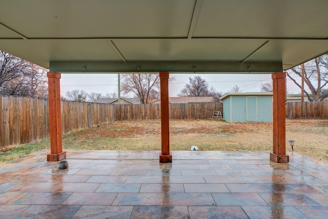 view of patio / terrace featuring a storage shed