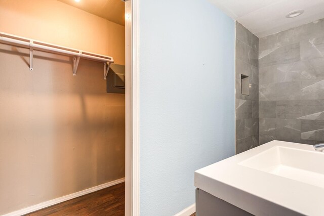 bathroom featuring hardwood / wood-style flooring and sink