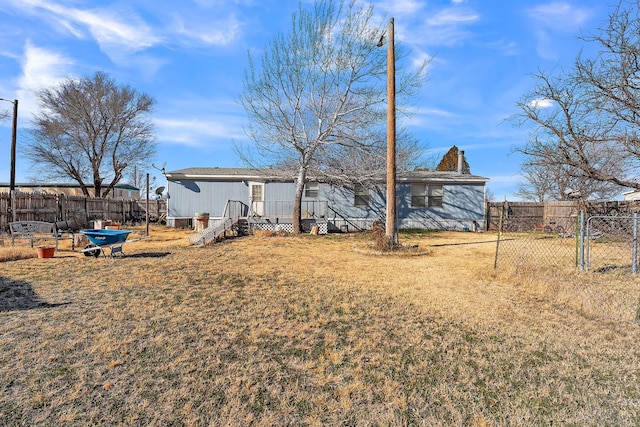 back of house with a yard