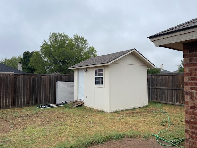 view of outbuilding with a lawn