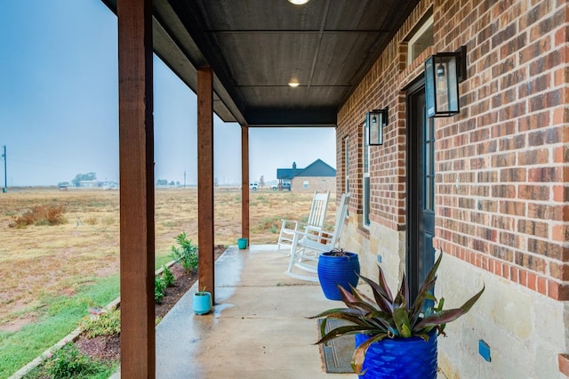 view of patio featuring a porch