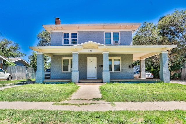 view of front of property featuring a front lawn and a porch