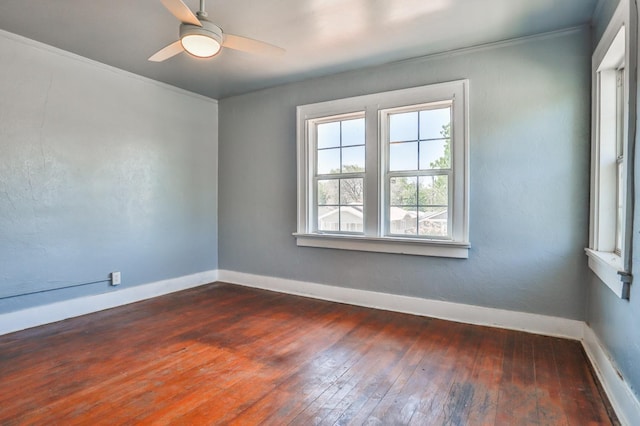 unfurnished room with ceiling fan, crown molding, and dark hardwood / wood-style flooring