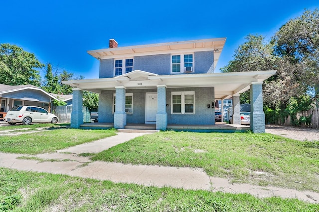 view of front of home featuring covered porch and a front lawn