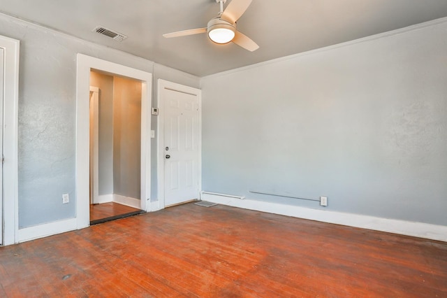 spare room featuring crown molding, ceiling fan, and hardwood / wood-style flooring