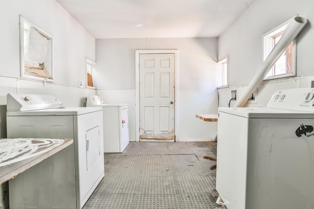 clothes washing area featuring washing machine and dryer