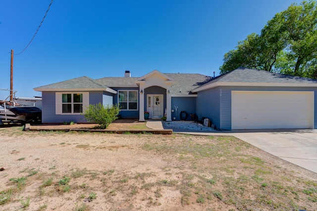 single story home with a shingled roof and driveway