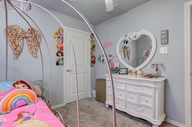 carpeted bedroom with visible vents and a closet