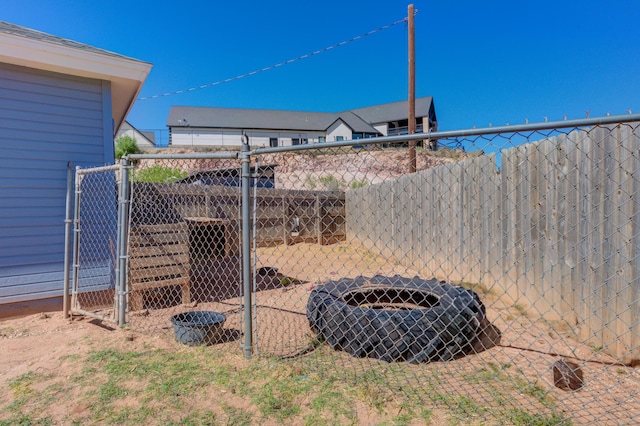 view of yard featuring a gate and fence