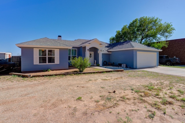 ranch-style home featuring driveway