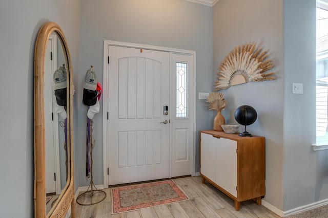 entryway with baseboards and light wood-type flooring