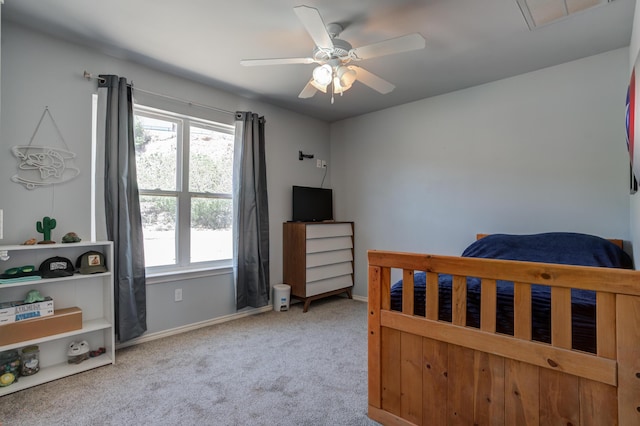 bedroom with ceiling fan, baseboards, visible vents, and carpet
