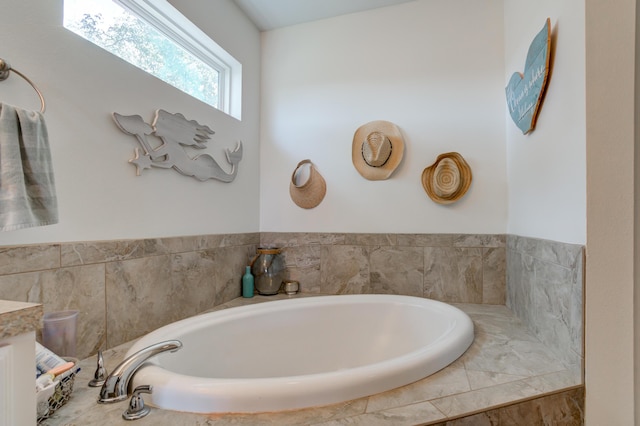 bathroom with a garden tub