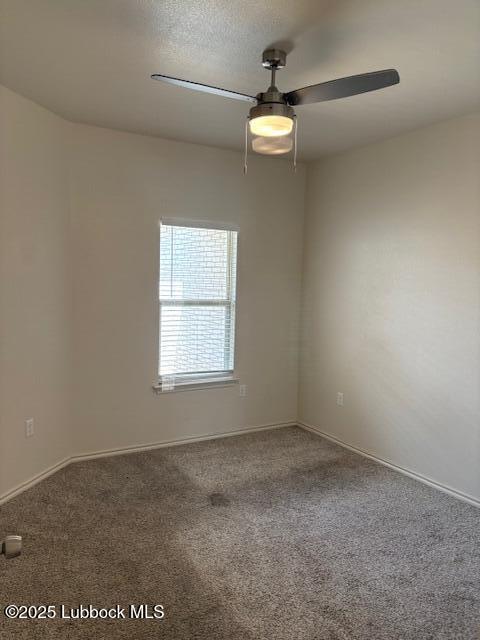 2612 136th St, Lubbock, TX 79423 - spare room featuring carpet floors, baseboards, and a ceiling fan