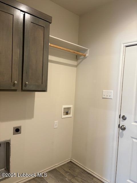 2612 136th St, Lubbock, TX 79423 - laundry room with electric dryer hookup, hookup for a washing machine, cabinet space, and baseboards