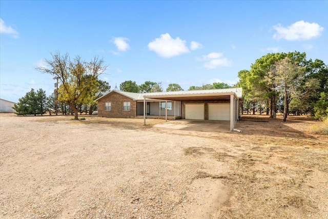 view of front of home with a carport