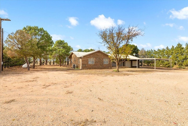 exterior space featuring a carport