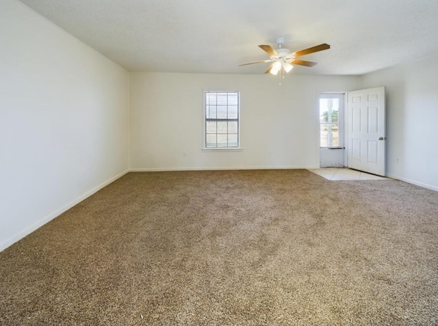 empty room with light carpet and ceiling fan