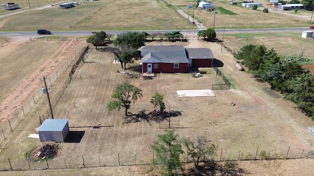 birds eye view of property with a rural view