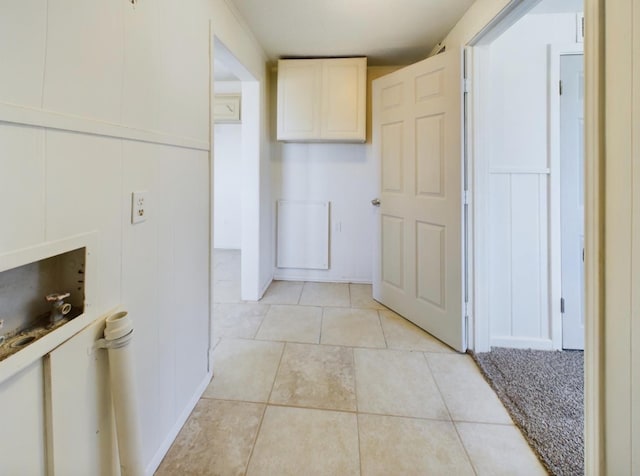 corridor featuring light tile patterned floors