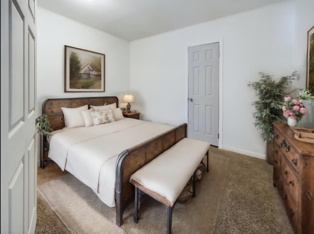 bedroom featuring dark carpet