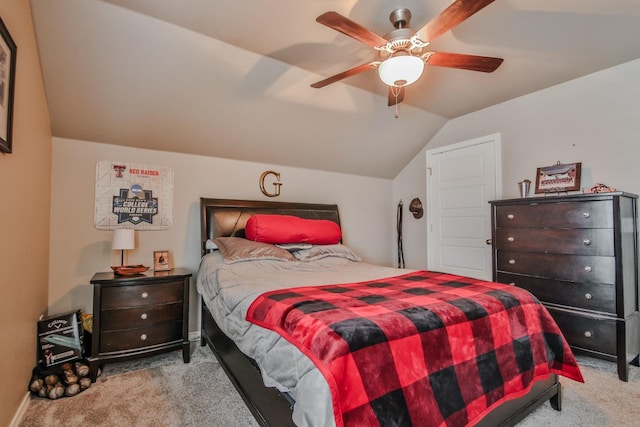 bedroom featuring light carpet, vaulted ceiling, and ceiling fan