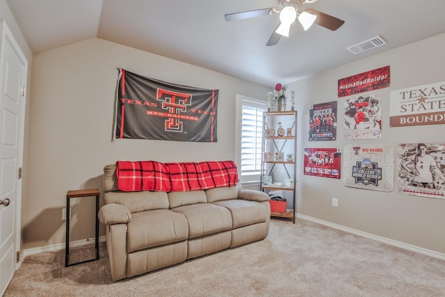 living room with vaulted ceiling, light colored carpet, and ceiling fan