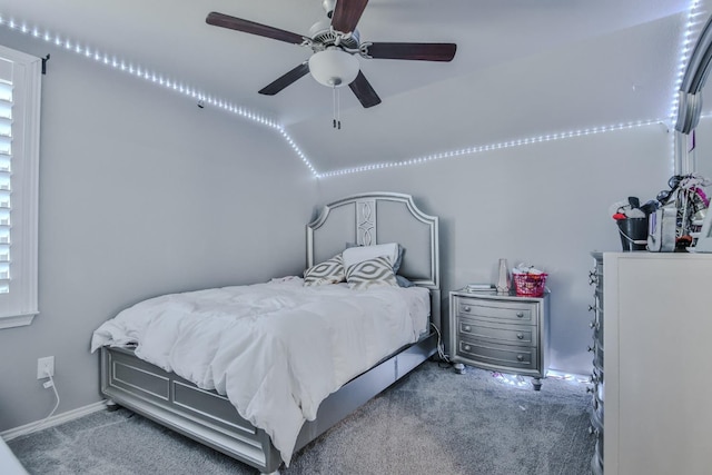 carpeted bedroom with lofted ceiling and ceiling fan