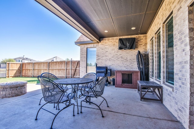 view of patio / terrace featuring a fire pit