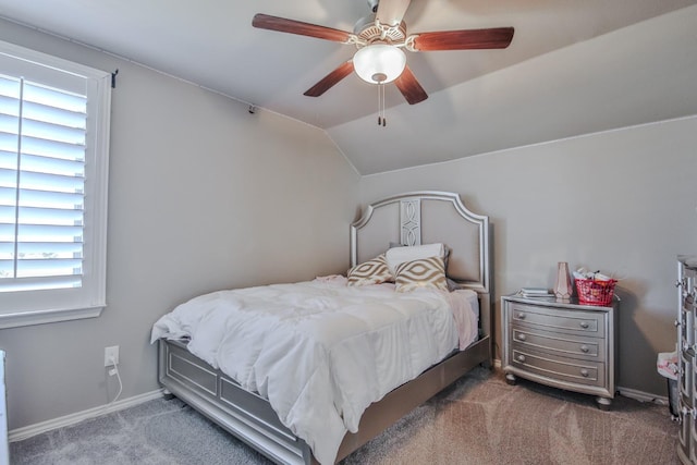 carpeted bedroom featuring ceiling fan, lofted ceiling, and multiple windows