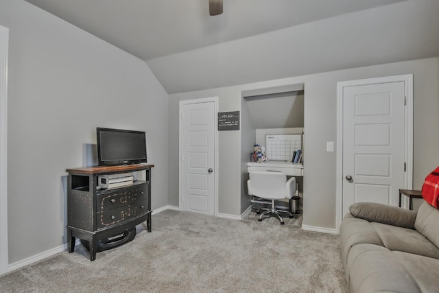 office with vaulted ceiling, light colored carpet, and ceiling fan