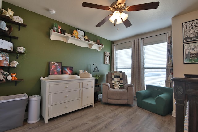 interior space featuring ceiling fan and wood finished floors