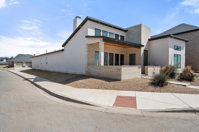12001 Vicksburg Ave, Lubbock, TX 79424 - modern home featuring a chimney