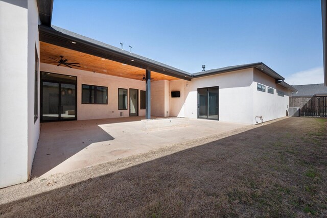 12001 Vicksburg Ave, Lubbock, TX 79424 - back of property featuring stucco siding, central AC, a patio area, and ceiling fan