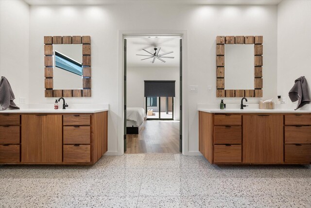 12001 Vicksburg Ave, Lubbock, TX 79424 - ensuite bathroom with two vanities and baseboards